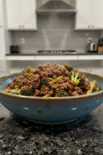 A vibrant platter of Quick Beef and Broccoli with tender beef slices and crisp broccoli florets glistening in a savory sauce.